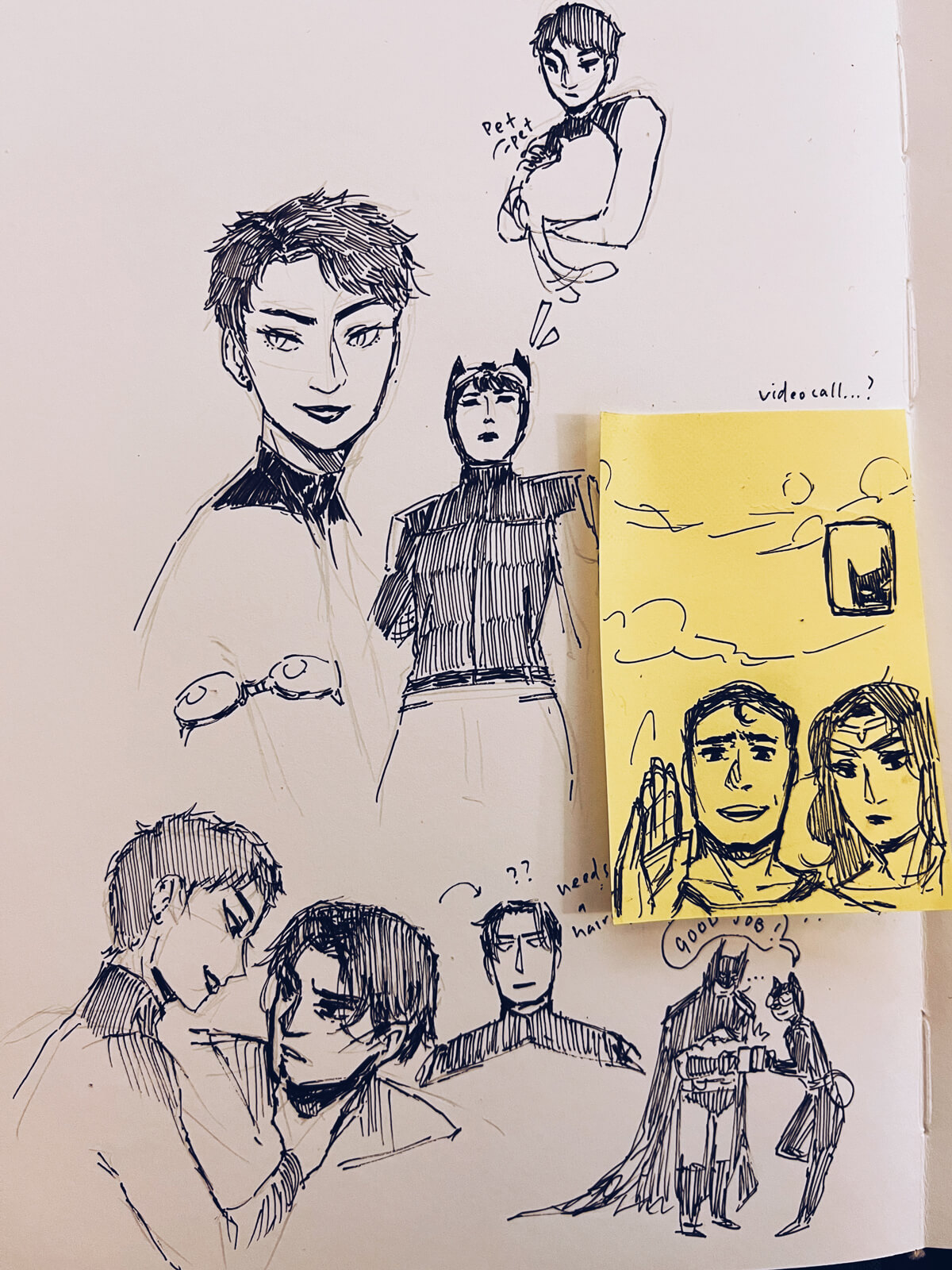 A bunch of ink doodles of Catwoman; Selina holding Bruce’s face; Selina petting a cat in her arms; Catwoman and Batman clinking mugs; Superman and Wonder Woman supposedly looking at their phone on a video call with Batman.